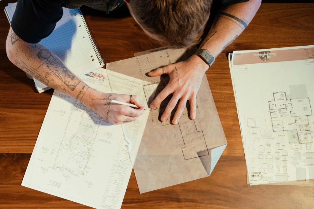 The House and Land Co team reviewing a home plan