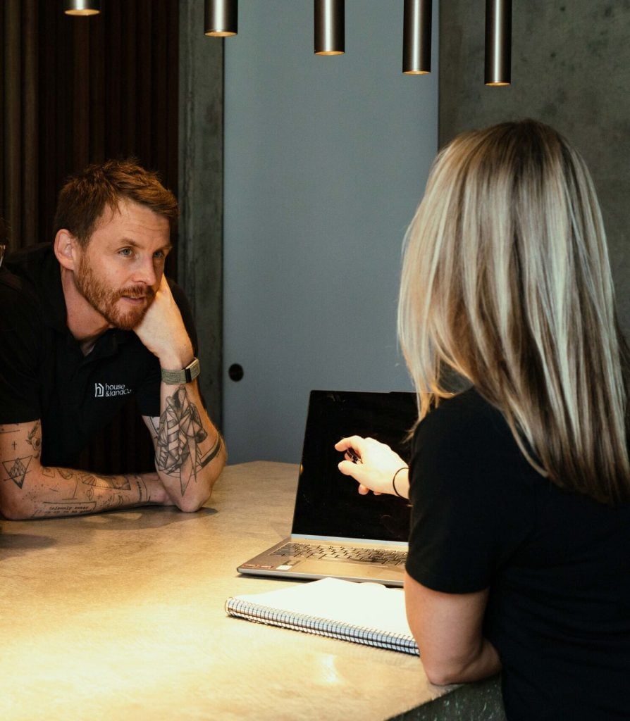 The House and Land Co team discussing home requirements with a buyer