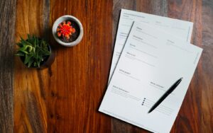 Loan documents and a pen on a table